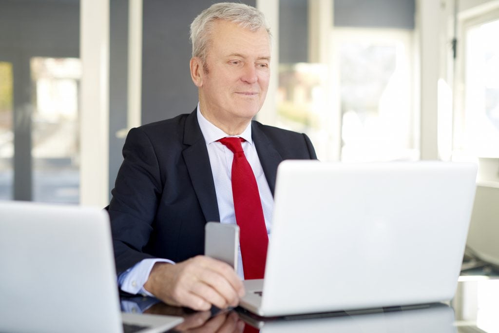 businessman cellphone laptop