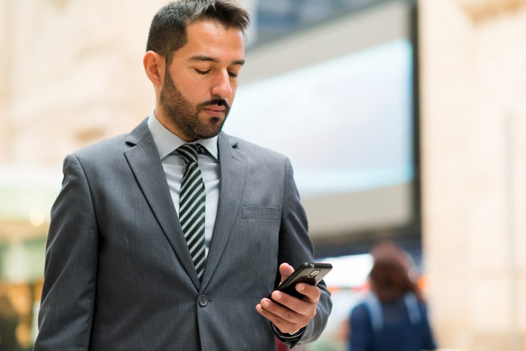 businessman cellphone sms