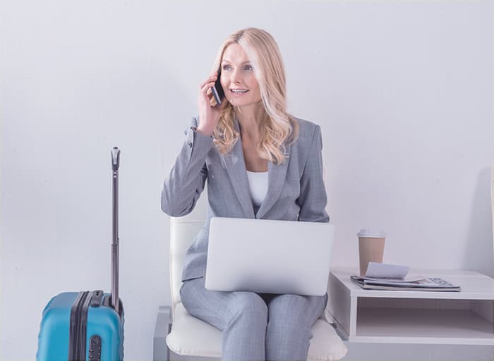 A photo of a lady dialing a 1-800 number for free.