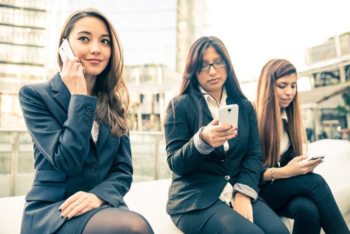 Business women with cell phones