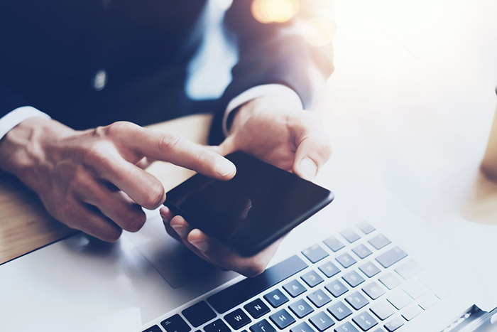 man cellphone laptop