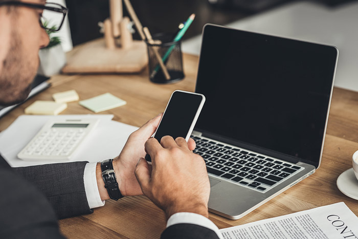 businessman cellphone laptop