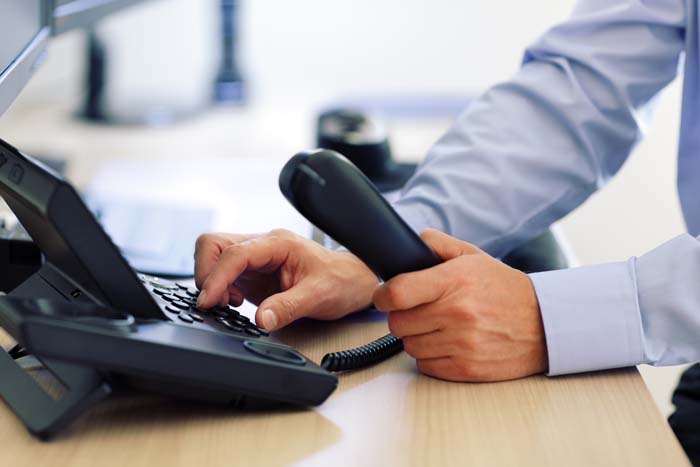 Starting a Business Phone Man Dialing Keypad