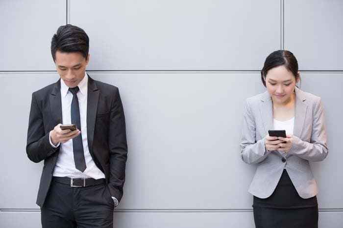 An image of two people getting Philippines Local Phone Numbers.