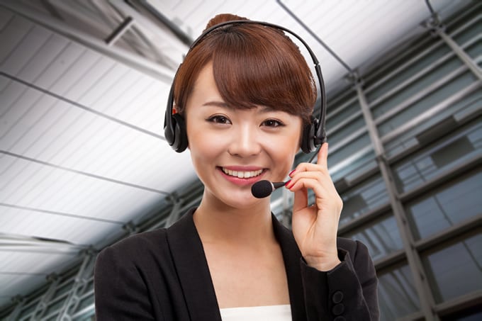 A call center agent using a Philippines toll free number.