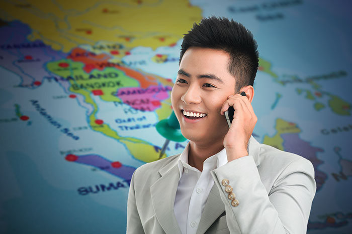 Man using a Singapore 1800 toll free number.