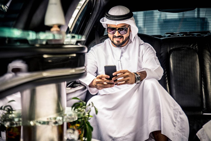An image of a Middle Eastern man buying a phone number.