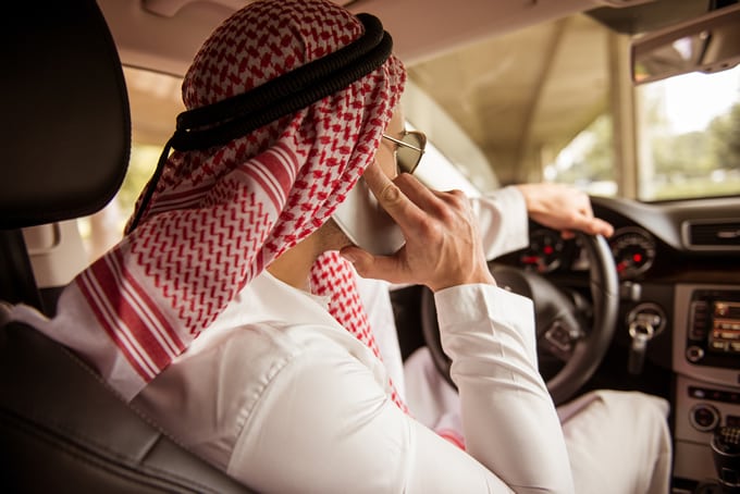 An image of a man buying Dubai virtual numbers on the phone.