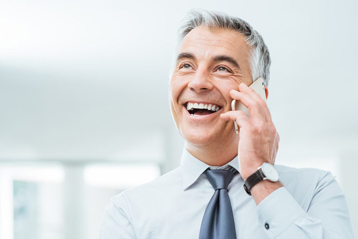 An image of a man using his European virtual phone number.