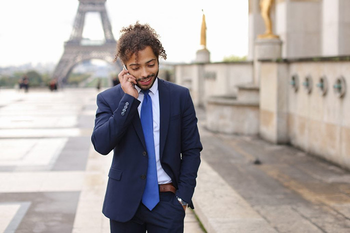 Image of a man using his France virtual phone number.