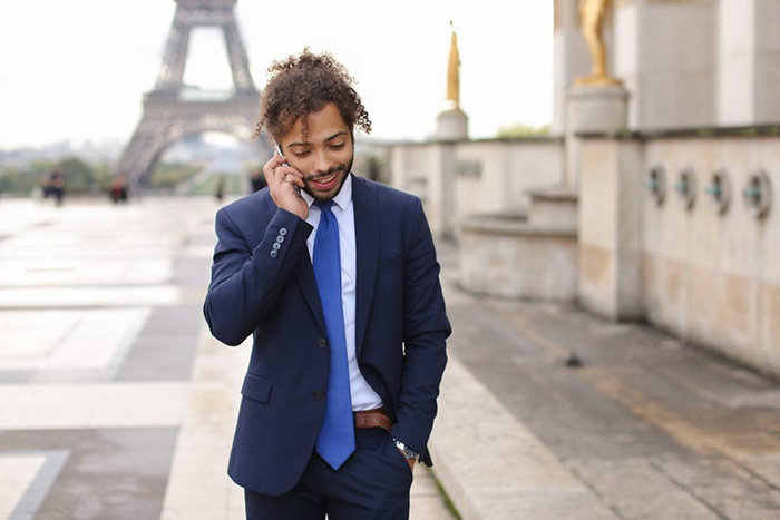 Image of a man using his France virtual phone number.